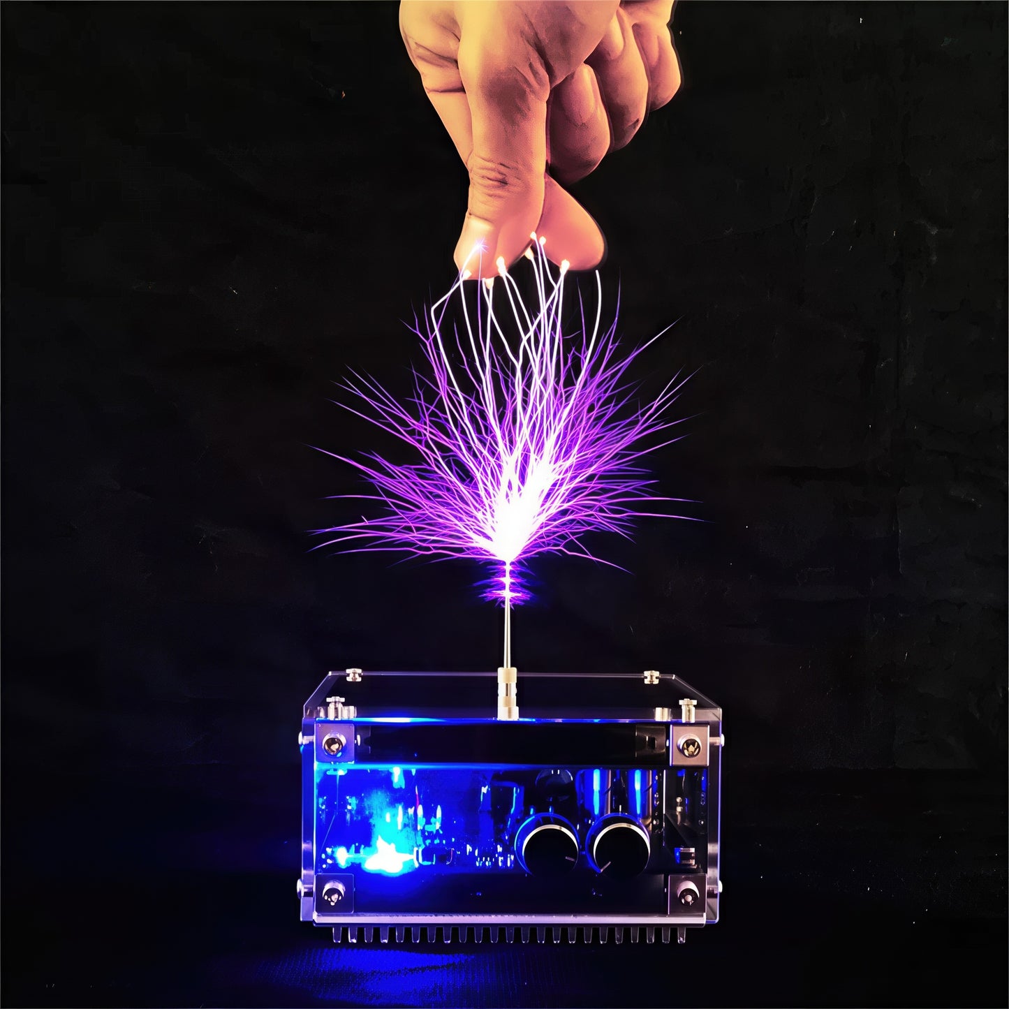 The Curious Mind Tesla Coil TC10 Plus plasma lamp with purple lightning arcs emanating from the top, interacting with a hand.