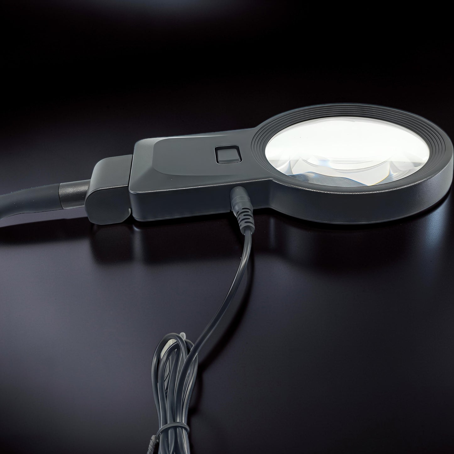 The Curious Mind Gooseneck LED Magnifier Desk Lamp with adjustable neck and illuminated lens for detailed hobby work.