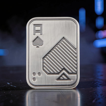 The Curious Mind Ace of Spades metal slider fidget toy with brushed silver finish and tactile ridges.