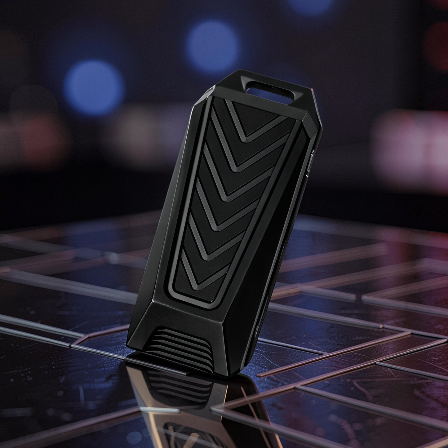 The Curious Mind black stainless steel chevron slider fidget toy with a textured chevron pattern and a loop at the top.