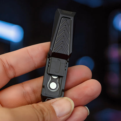 The Curious Mind black stainless steel chevron slider fidget toy with tactile chevron pattern and magnetic closure.