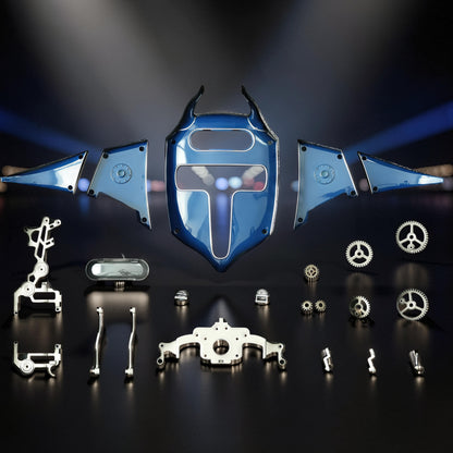 The Curious Mind Manta Ray DIY Kit features blue metal parts and gears for building a mechanical ocean creature.