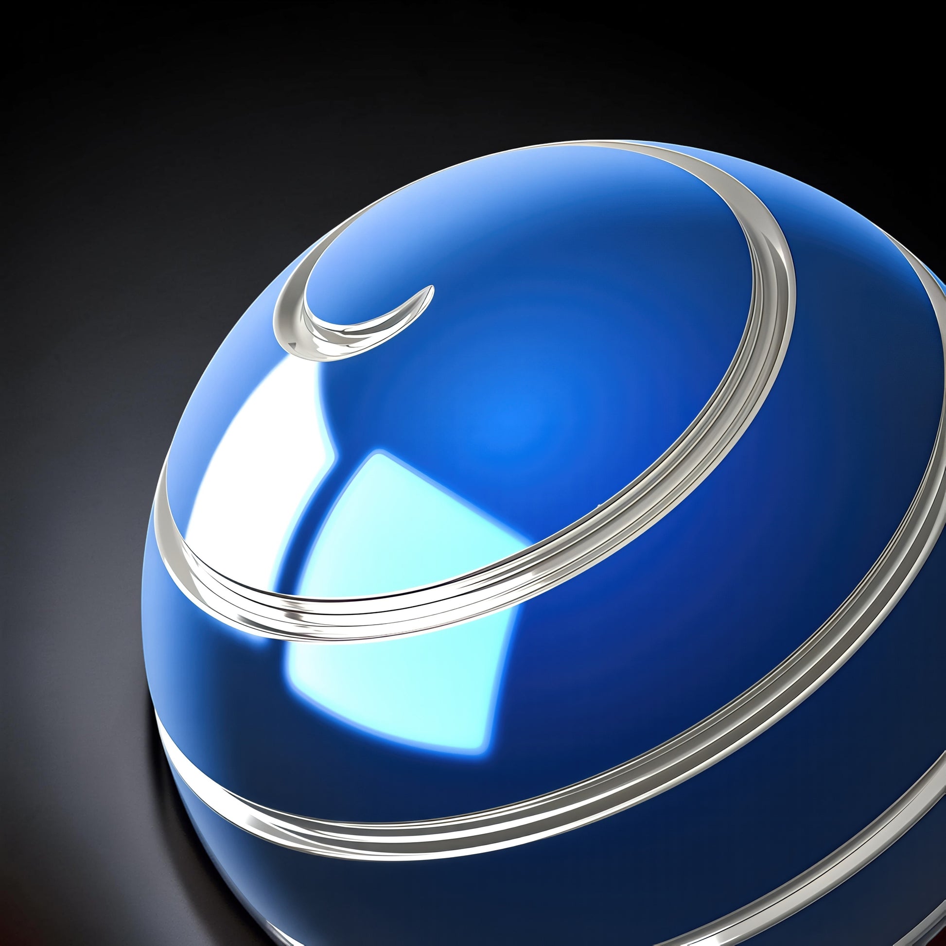 The Curious Mind high-gloss blue metal desktop stress ball with silver spiral detailing. Weighted fidget toy for focus and stress relief.