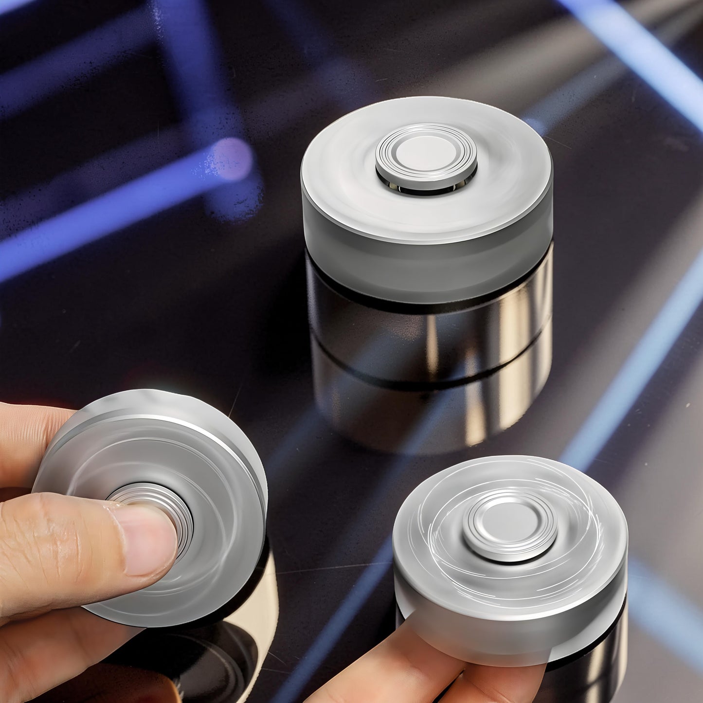 The Curious Mind Brass Finger Gyro Spinner, a silver metal fidget toy with a balanced profile for smooth rotation.