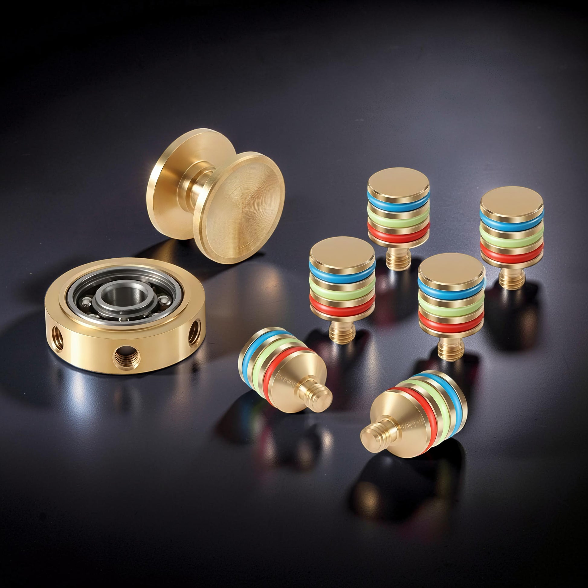 The Curious Mind brass hand spinner with blue, green, and red accents. Includes a bearing and separate spinner components.