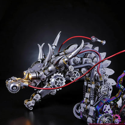 The Curious Mind Chinese Dragon 3D metal model kit with intricate gears, horns, and red tubing. Steampunk-inspired mechanical sculpture.
