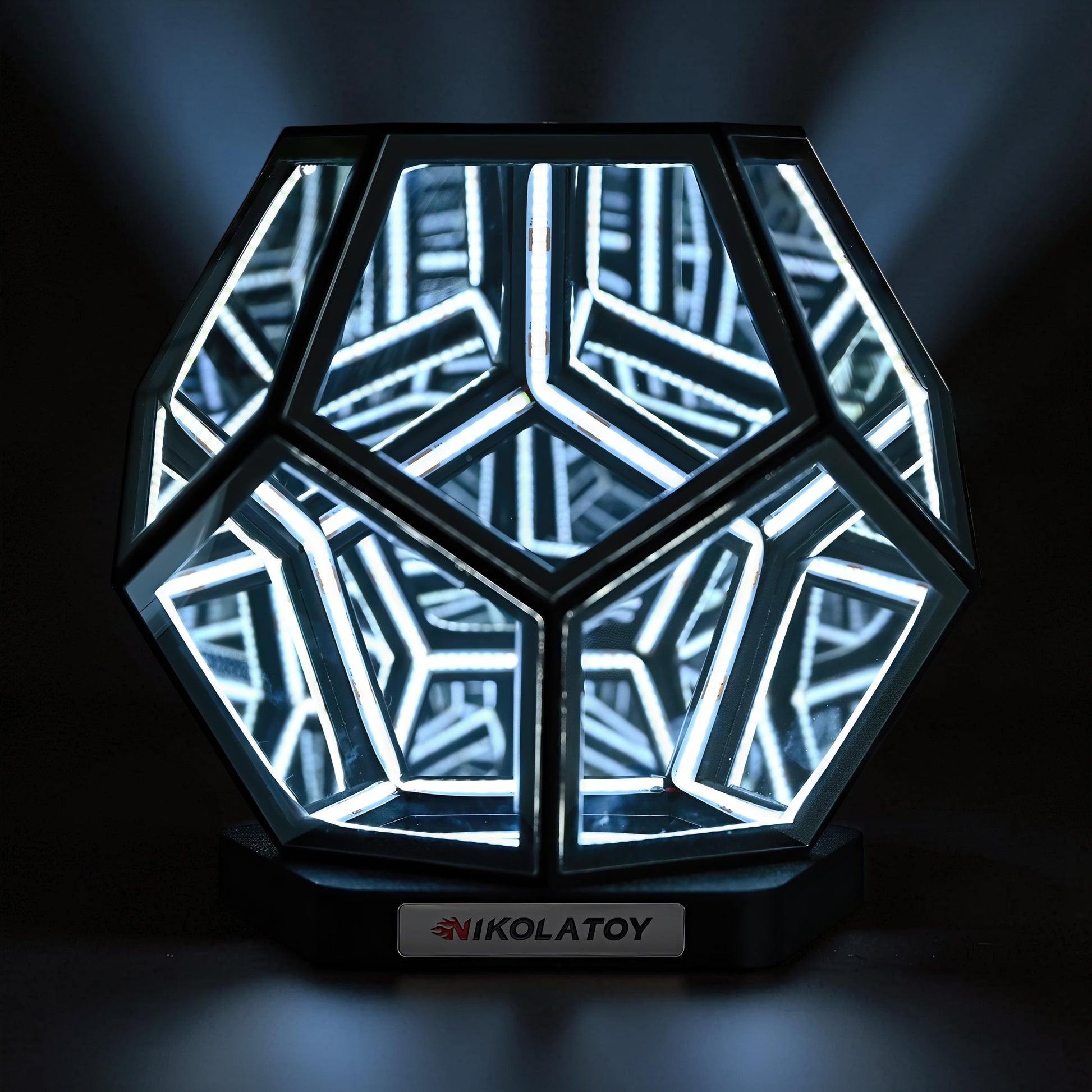 The Curious Mind Infinite Space Abyss Dodecahedron LED Night Light with white LED lights and a black base.