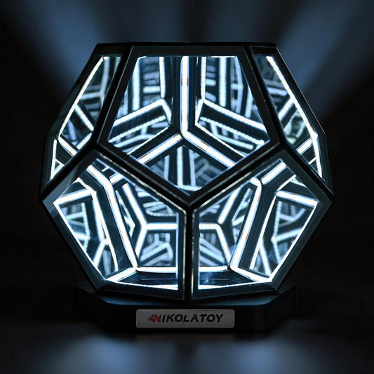 The Curious Mind Infinite Space Abyss Dodecahedron LED Night Light with white LED lights and a black base.