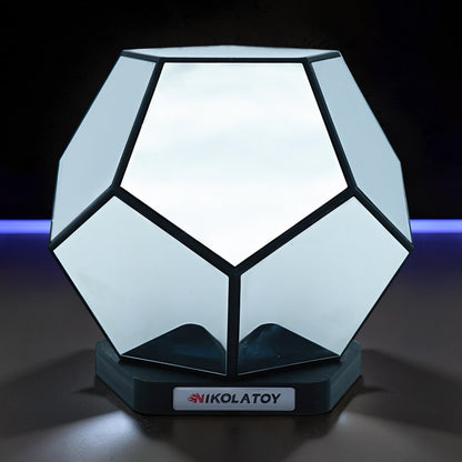 The Curious Mind Infinite Space Abyss Dodecahedron LED Night Light, a geometric desk accent made of white PLA with black trim.
