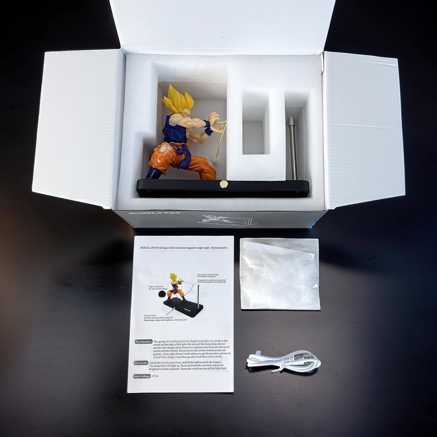 The Curious Mind Dragon Ball Kamehameha night light featuring Goku in an action pose, with magnetic LED display and PLA material.