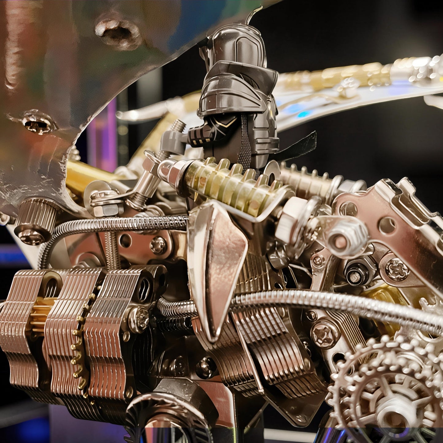 The Curious Mind Dragon 3D metal model kit with intricate mechanical details and iridescent wings, featuring a knight figure.