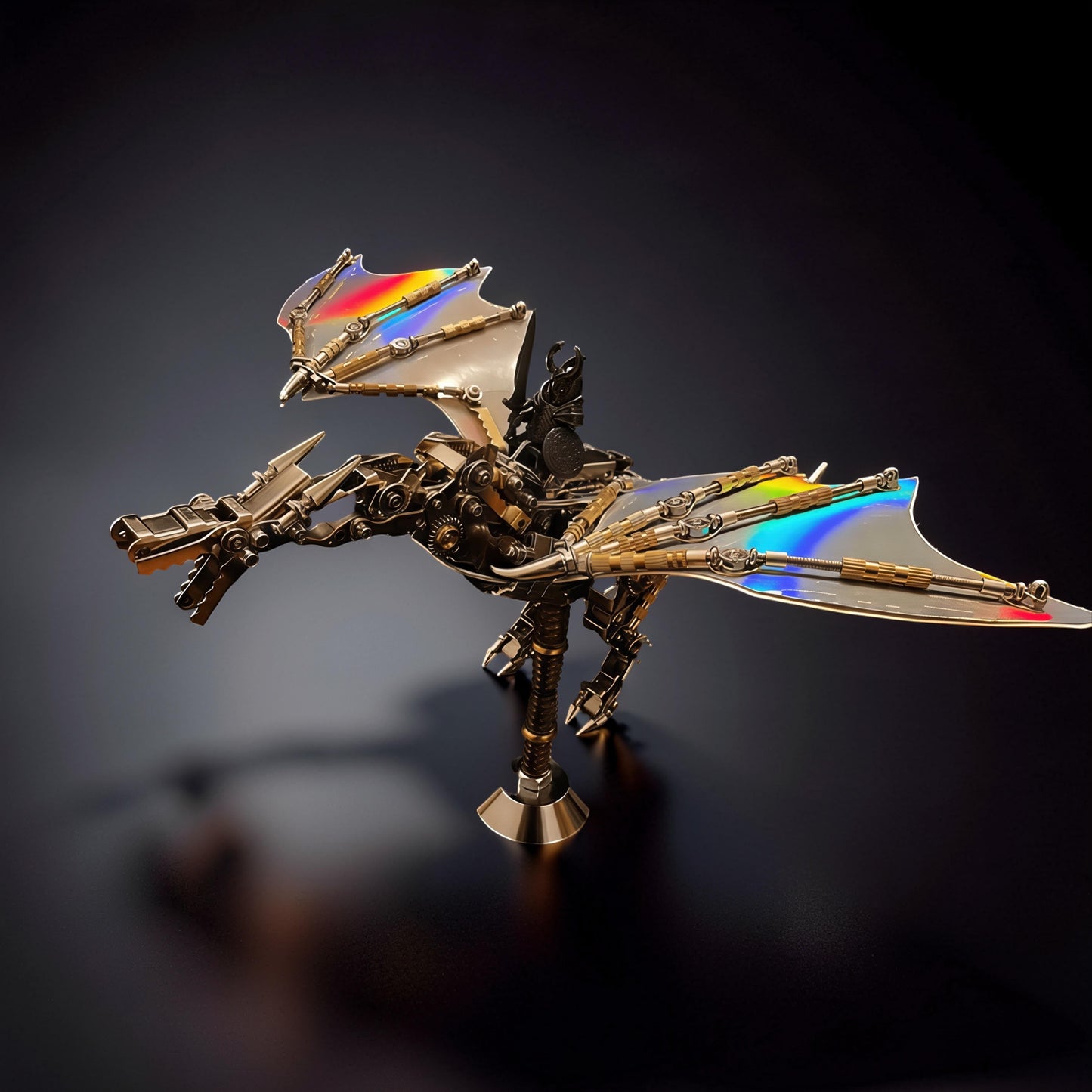 The Curious Mind 3D metal model kit of a dragon with iridescent wings and intricate mechanical details, displayed on a stand.