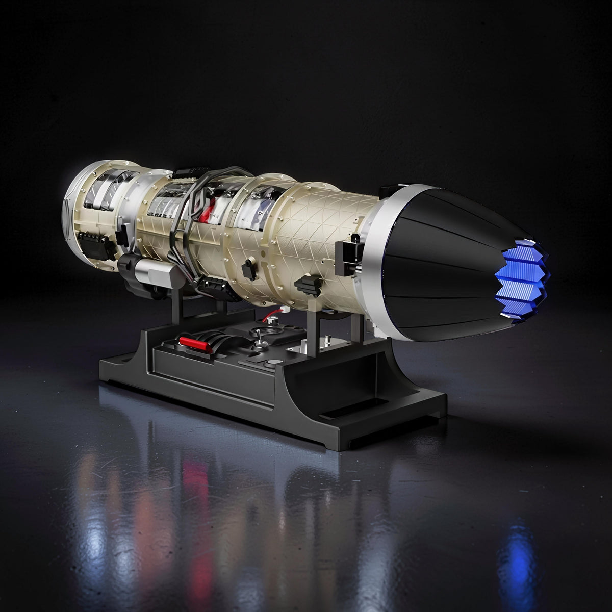 The Curious Mind Fighter Jet Turbofan DIY Kit model, gold and silver with black and blue accents, on a black display stand.