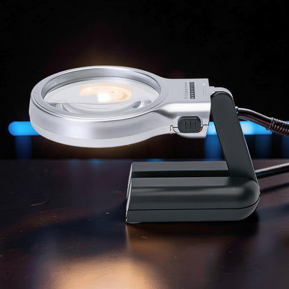 The Curious Mind Foldable LED Magnifier Glass with silver casing and black stand, ideal for hobbyists and detailed work.