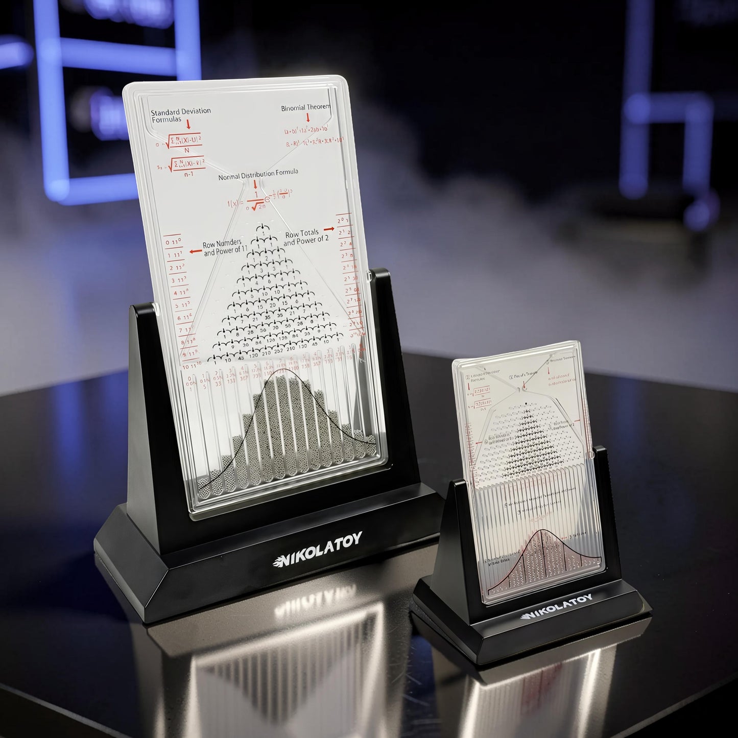 The Curious Mind Large Galton Board Distribution Model, acrylic and metal, displays probability and physics formulas with a visual representation of the normal distribution.