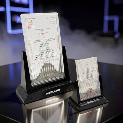 The Curious Mind Large Galton Board Distribution Model, acrylic and metal, displays probability and physics formulas with a visual representation of the normal distribution.