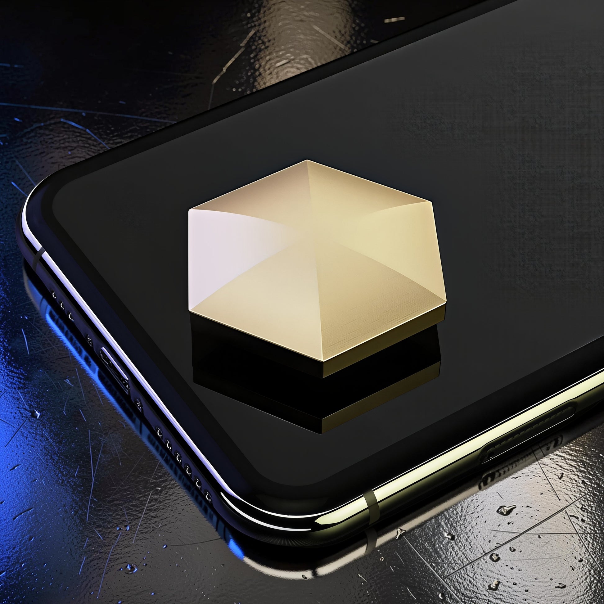 The Curious Mind gold hexagon kinetic desk spinner made of metal, resting on a smartphone.