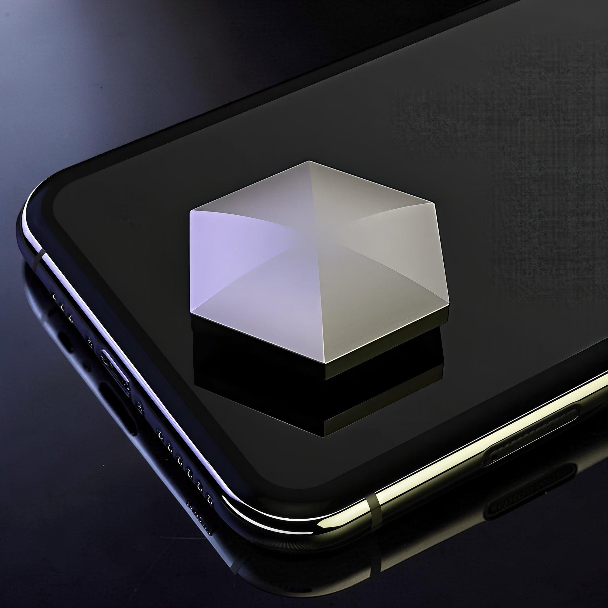 The Curious Mind Flipo Flip Hexagon kinetic desk spinner, a weighted metal geometric toy with a polished silver finish, shown on a smartphone.