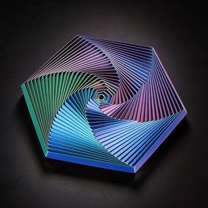 The Curious Mind Hexagon Push Fidget sensory toy with iridescent blue, green, and pink geometric spiral design.