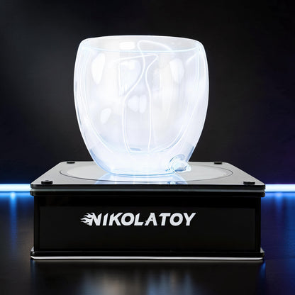 The Curious Mind Inert Gas Lightning Cup with display base, a clear glass orb with internal white electrical arcs on a black illuminated base.