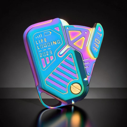 The Curious Mind Iridescent Chip Slider fidget toy with 'LIFE LOADING 2023' text and metallic finish.