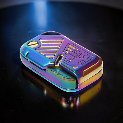 The Curious Mind Iridescent Chip Slider fidget toy with push-and-return action. Compact metal design with rainbow iridescent finish.