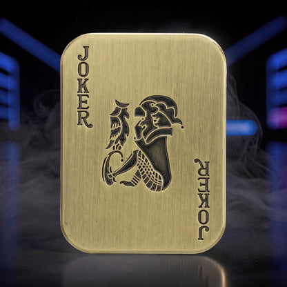 The Curious Mind Joker Poker magnetic slider, a brass-toned metal fidget toy shaped like a playing card with a joker design.
