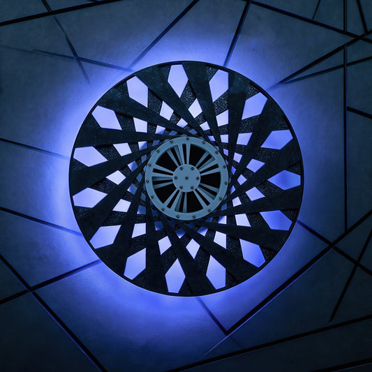 The Curious Mind Time Travel Edition desktop ornament, a circular PLA kinetic sculpture with intricate geometric patterns and a central white wheel, illuminated by blue light.