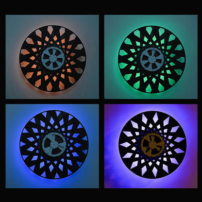 The Curious Mind Time Travel Edition desktop ornament, a black PLA kinetic sculpture with geometric cutouts illuminated by orange, green, blue, and purple lights.