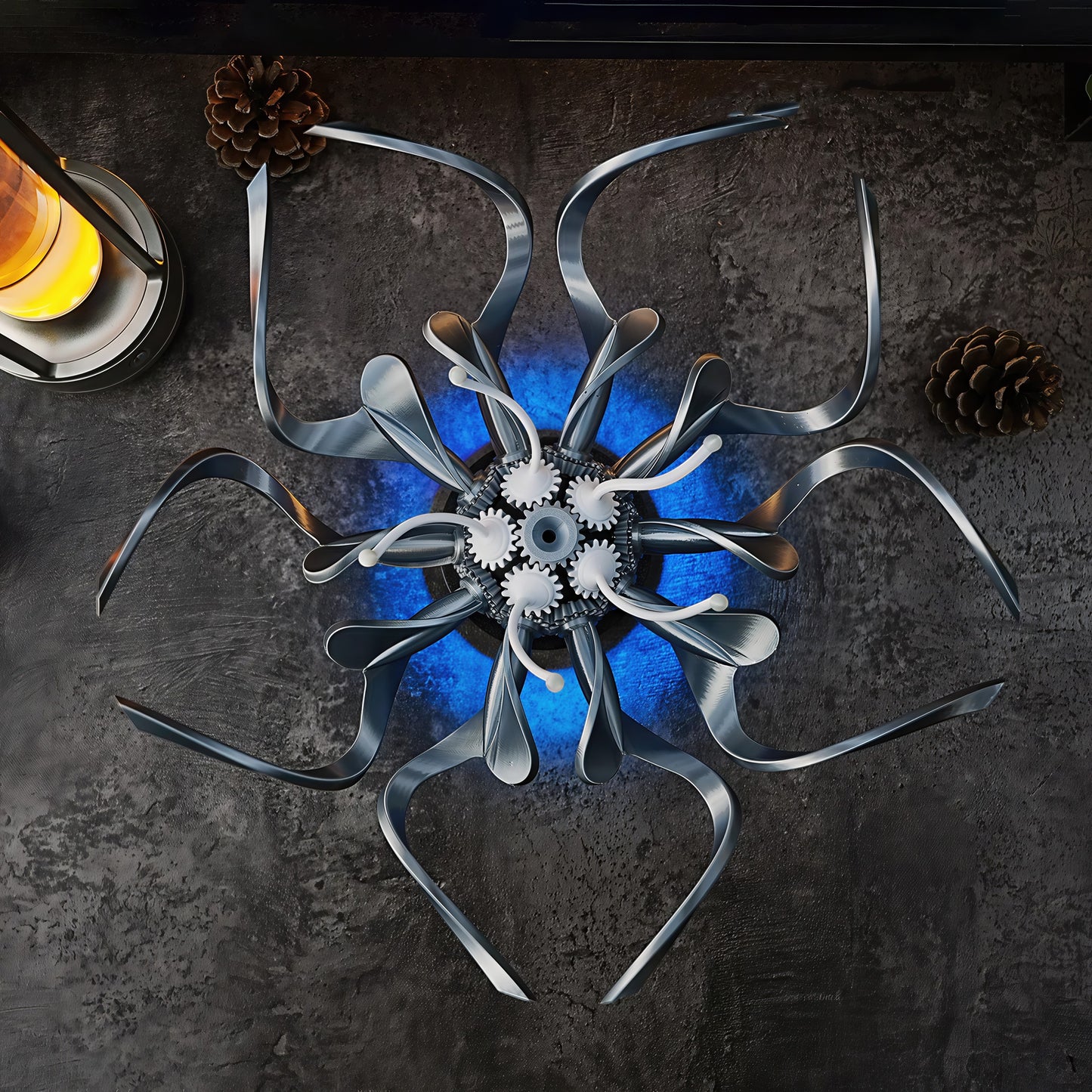 The Curious Mind Mechanical Kinetic Flowers Sculpture Gallery Edition, a silver PLA desk sculpture with intricate gears and blue LED lighting.
