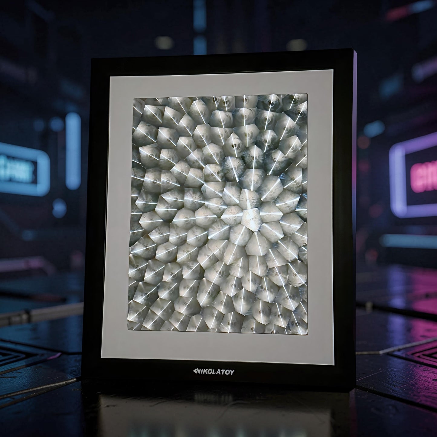 The Curious Mind Laser Light Effect Art Frame features a geometric, illuminated display with a wood and metal construction. The abstract pattern creates a dynamic visual effect.