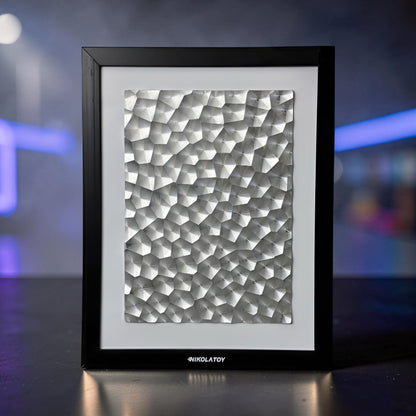 The Curious Mind Laser Light Effect Art Frame with a textured silver metal surface in a black wood frame.
