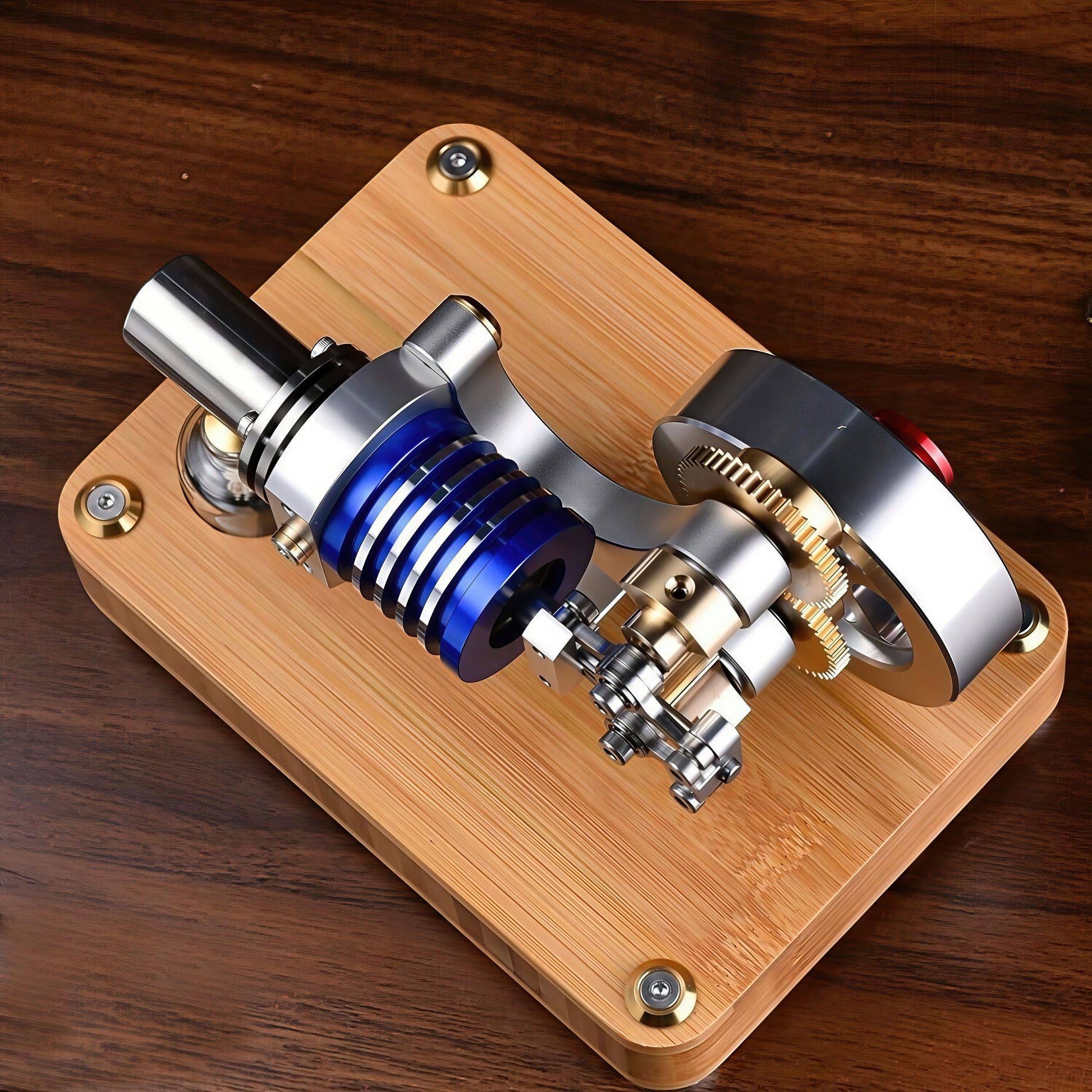 The Curious Mind M20 Stirling engine model with blue cylinder, metal components, and gears on a wooden base.