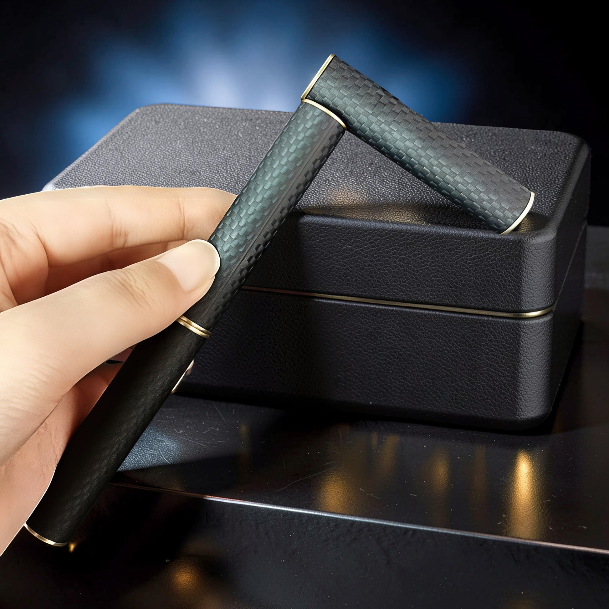 The Curious Mind Magnetic Carbon Fiber Slider fidget toy with gold accents, held in hand.