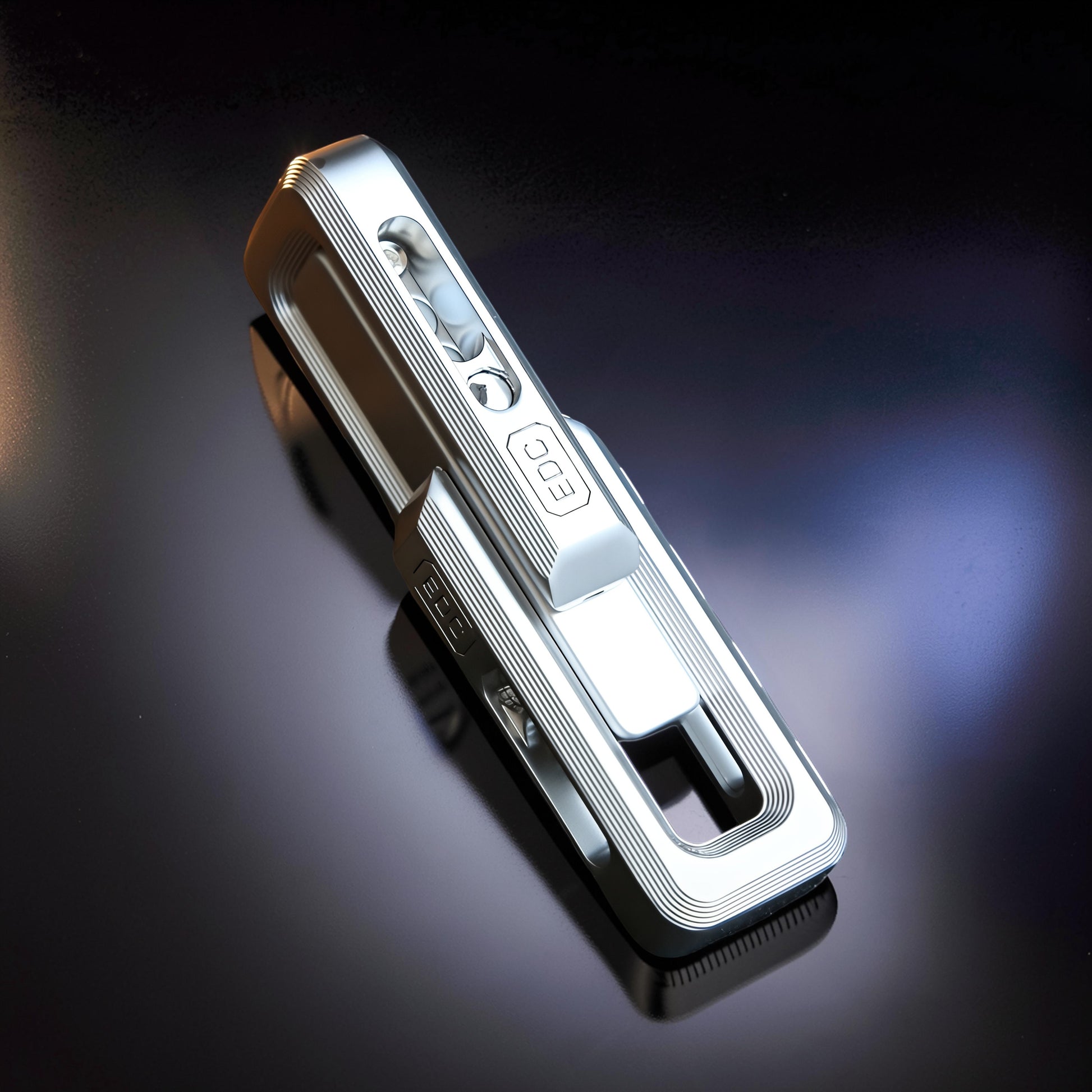 The Curious Mind Magnetic Double Push Slider fidget toy, made of silver metal with ribbed detailing and 'EDC' embossed. Features a compact, premium design for stress relief.