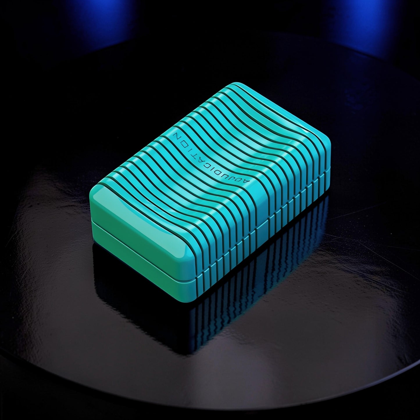 The Curious Mind Soap Box Magnetic Slider fidget toy in teal with a wavy, ribbed texture and black accents. Compact metal design for stress relief.