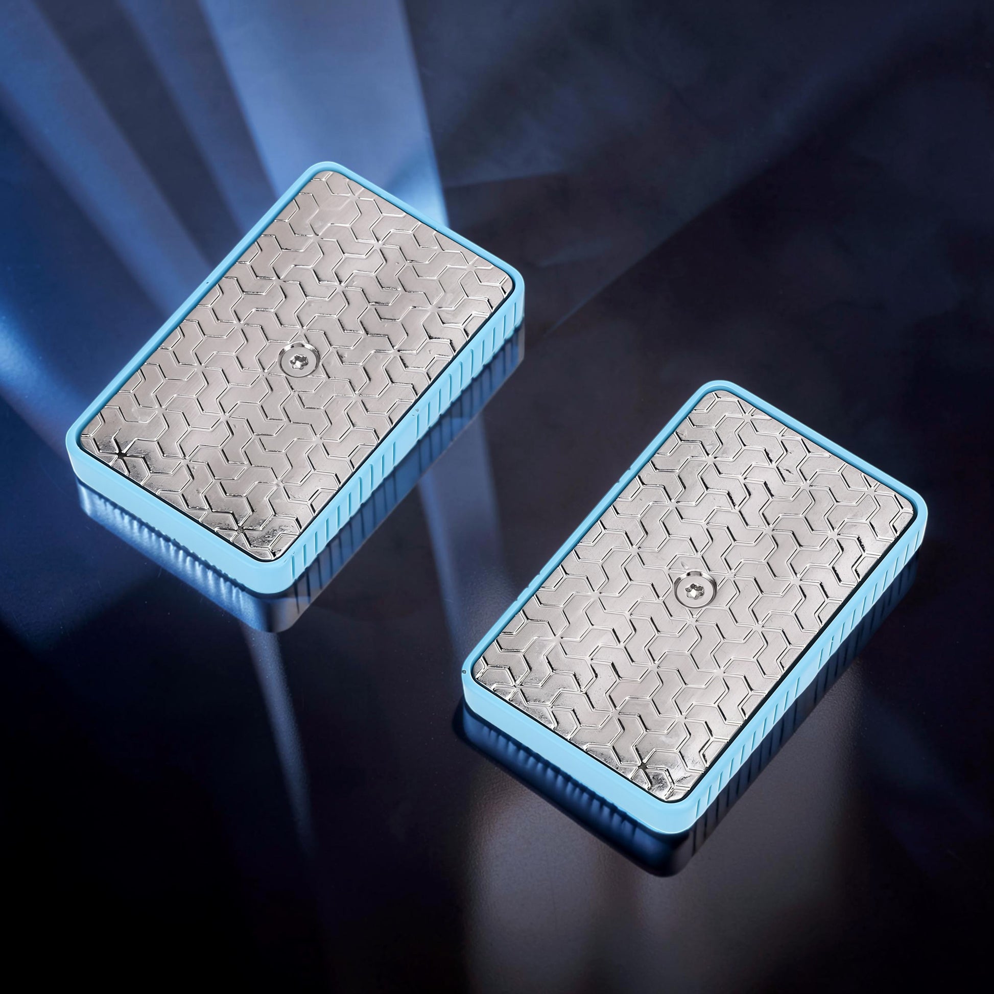 The Curious Mind Soap Box Magnetic Slider fidget toy with silver textured top and light blue frame.