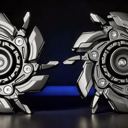 The Curious Mind Open Armour Magnetic Spinner features a metallic gunmetal finish and intricate mechanical detailing. Two spinners are shown close-up against a dark background with a blue illuminated base.