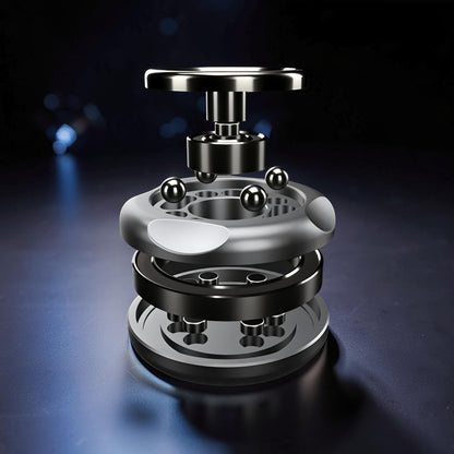 The Curious Mind Magnetic Master 2.0 metal spinner with visible bearings and magnetic accents, designed for EDC and focus breaks.