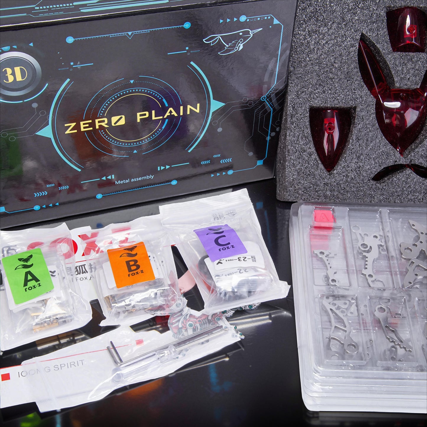 The Curious Mind Mechanical Fox 3D metal model kit with translucent red accents and metal assembly parts.