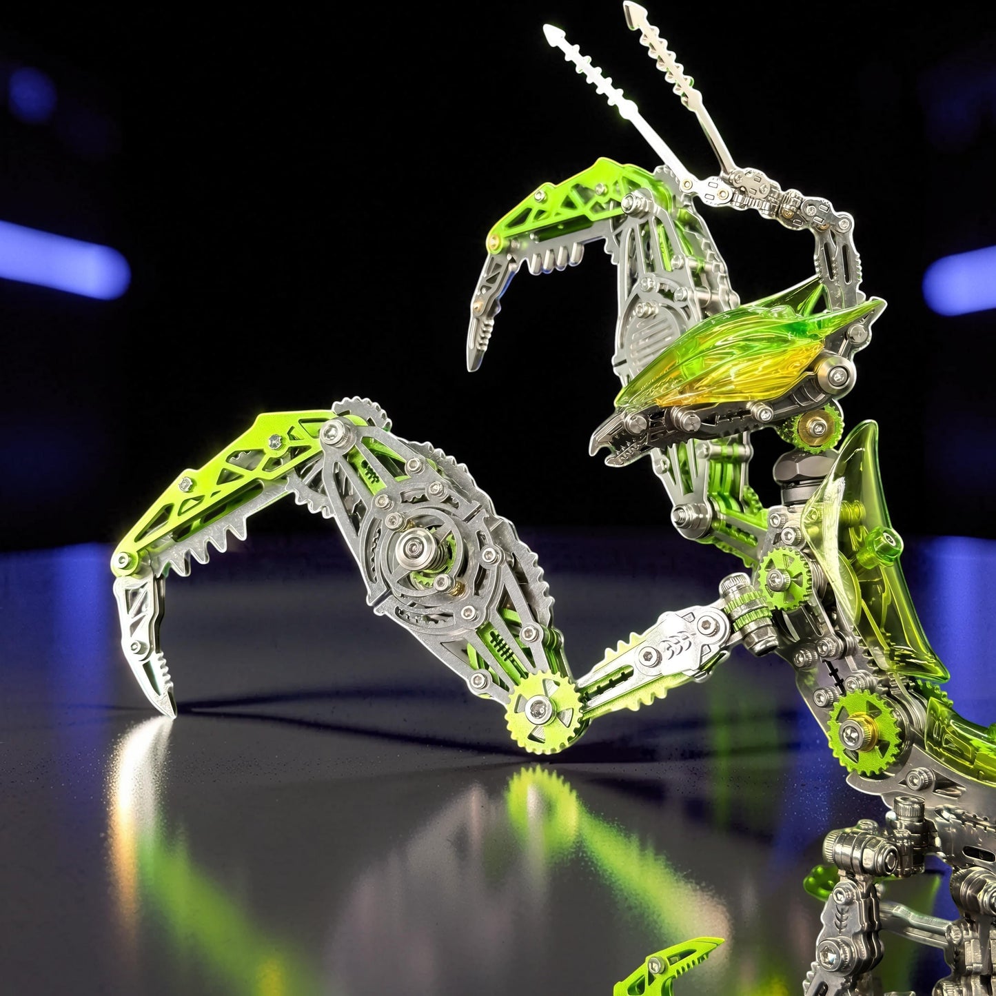 The Curious Mind Mechanical Mantis 3D metal model kit with green and silver metallic parts, intricate gears, and a translucent green body.
