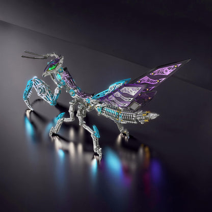The Curious Mind Mechanical Mantis 3D metal model kit with purple and blue accents, intricate details, and articulated limbs.
