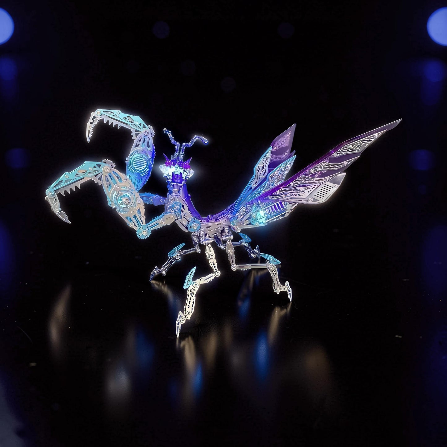 The Curious Mind Mechanical Mantis 3D metal model kit with purple and blue metallic finish, intricate details, and articulated limbs.