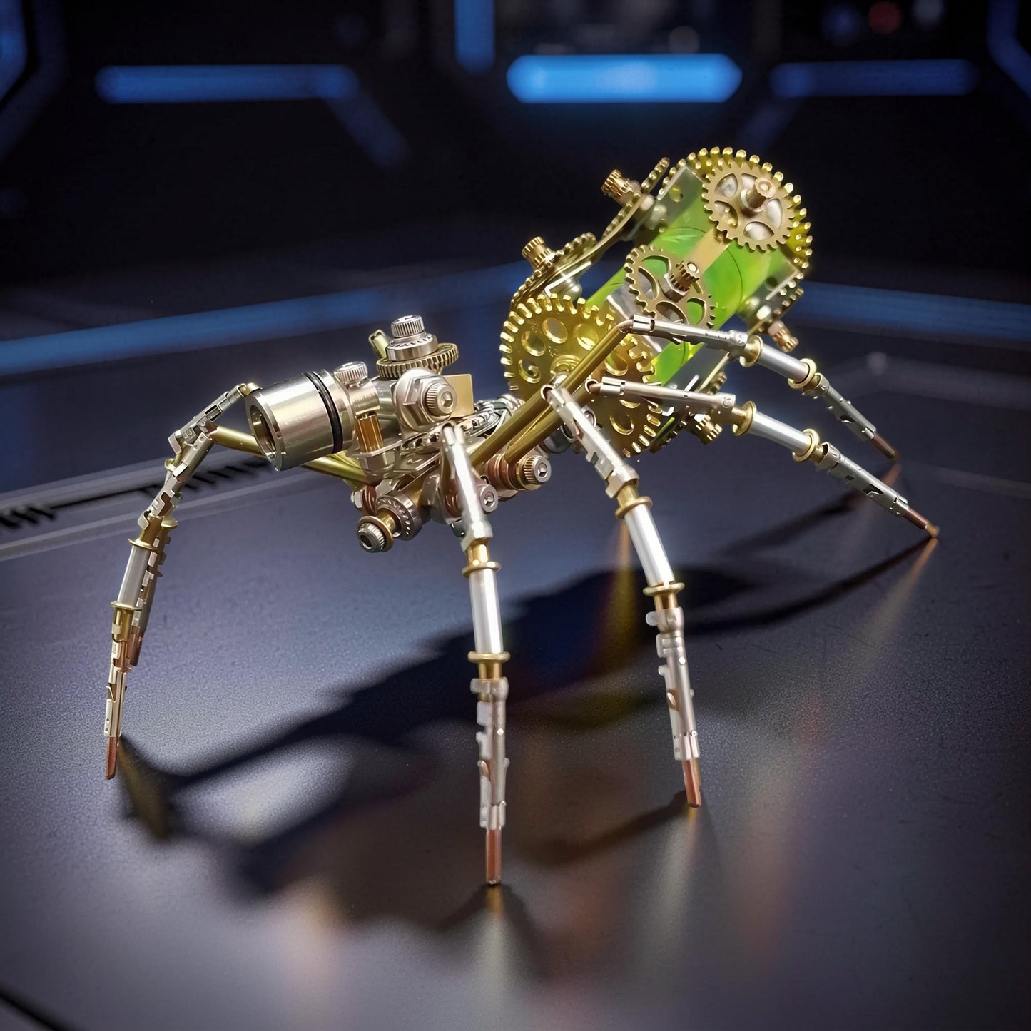 The Curious Mind Style E mechanical spider DIY kit, made of metal with intricate gears and a green body detail.