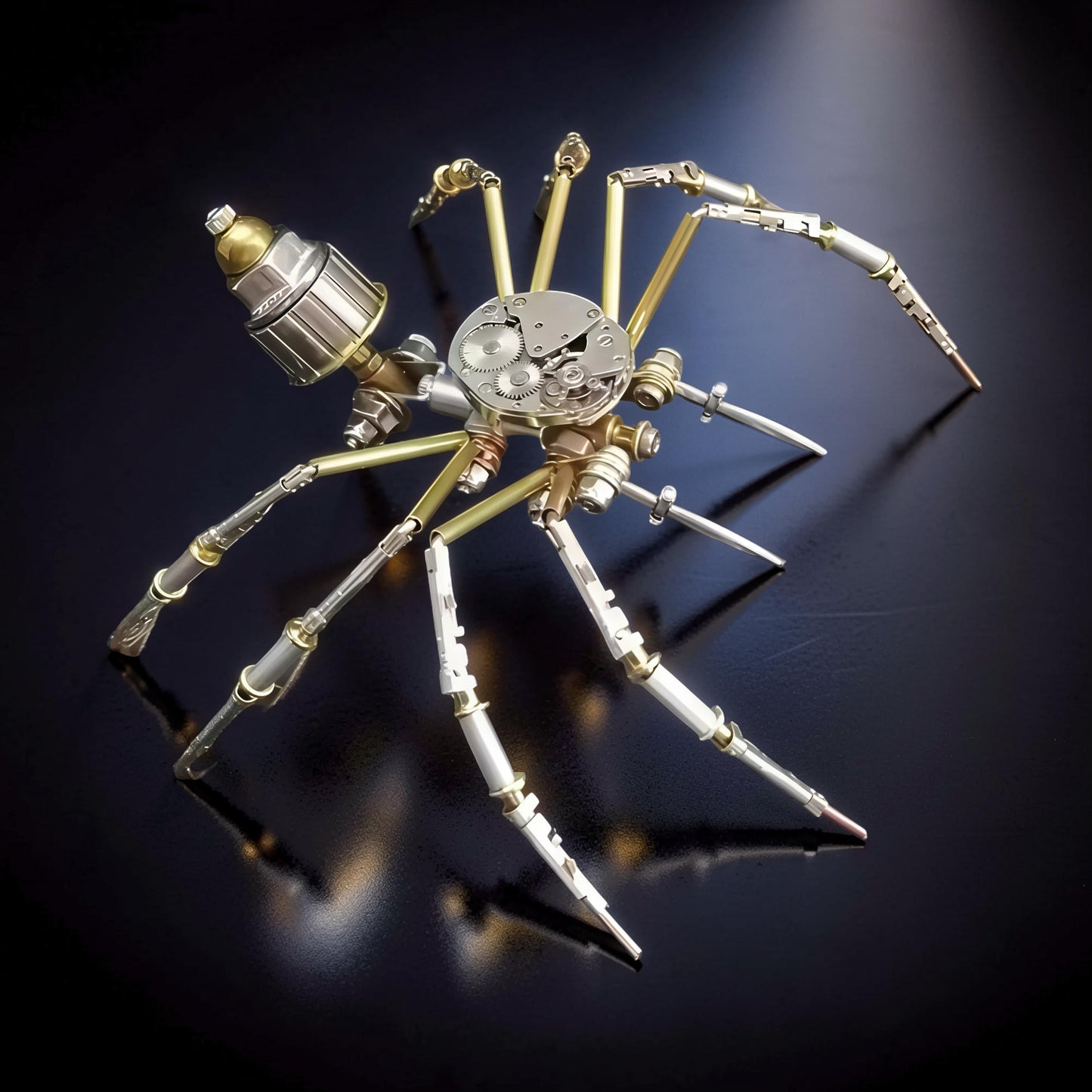 The Curious Mind Style A mechanical spider model kit, made of metal with visible gears and intricate details.