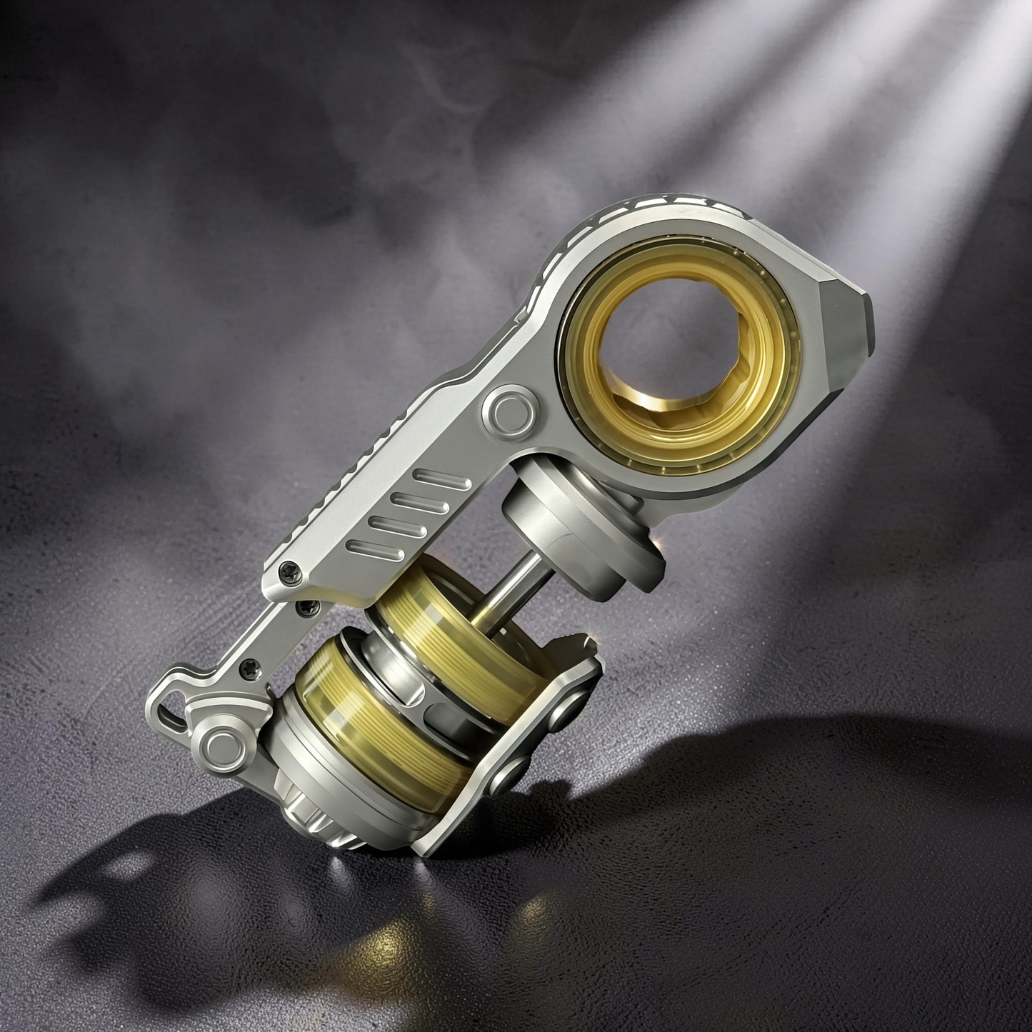 The Curious Mind Fork Ratchet Metal Slider fidget toy with silver and gold accents, featuring a compact push-and-return mechanism.