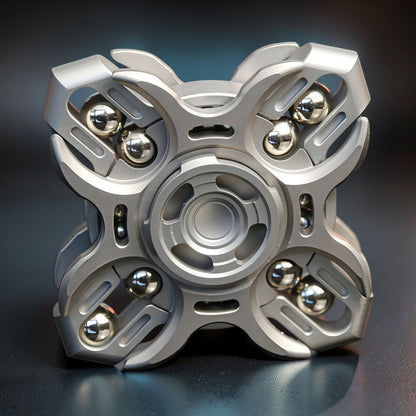 The Curious Mind Oracle Metal EDC Fidget Spinner in silver, featuring a complex geometric design with visible ball bearings for smooth tactile play.