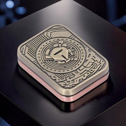 The Curious Mind Three-Body Push Card Fidget toy, metal construction with intricate circuit board design and pink base.