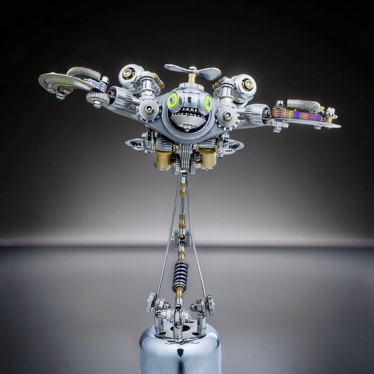 The Curious Mind Punk-Style 3D metal model kit of a robot turtle with silver and gold metal parts, green eyes, and a propeller.