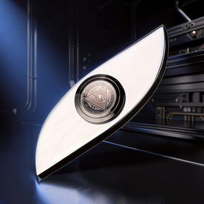 The Curious Mind Power Eye Sensory Spinner, a premium metal fidget toy with an all-seeing eye emblem.